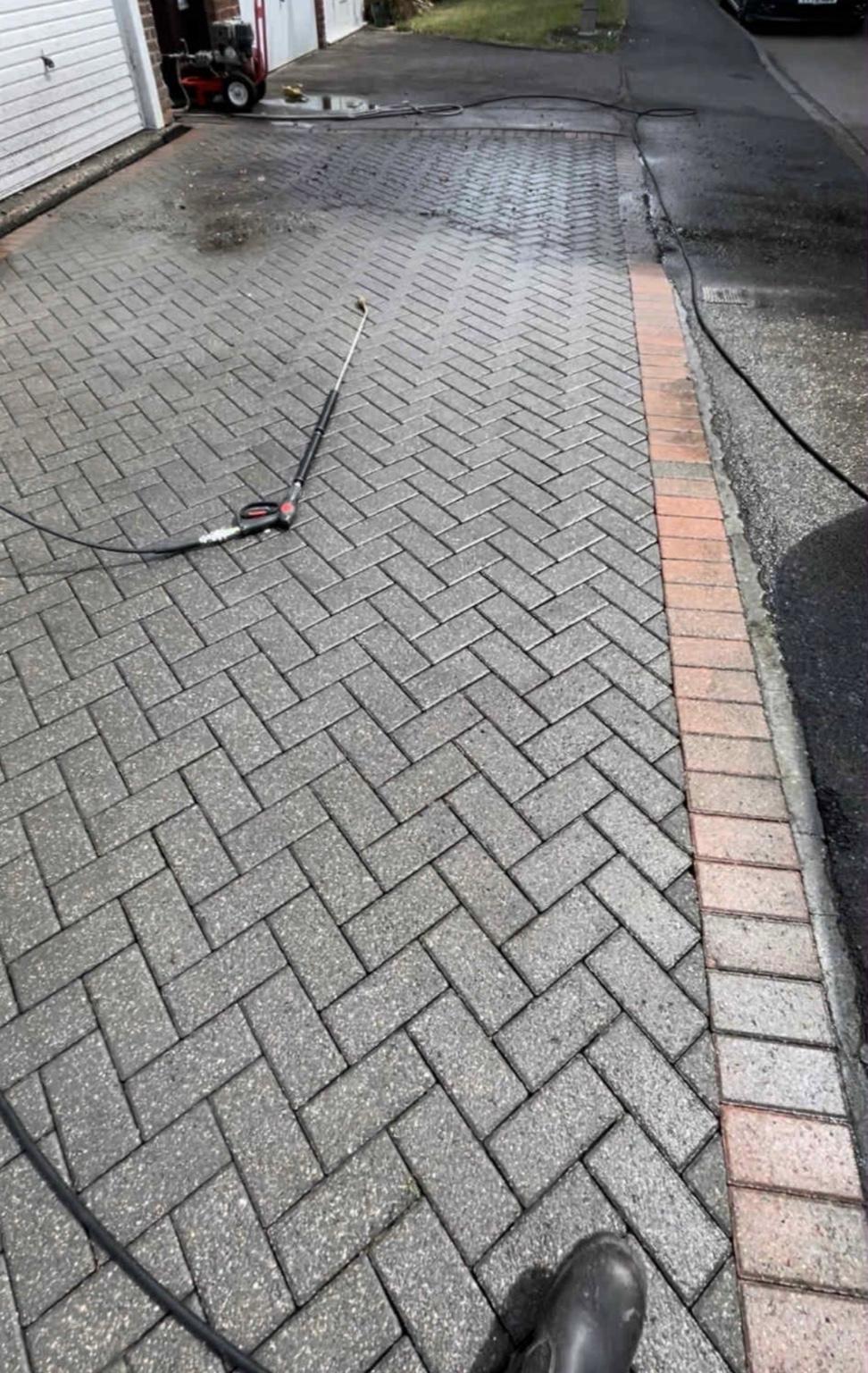 Pressure washing in progress